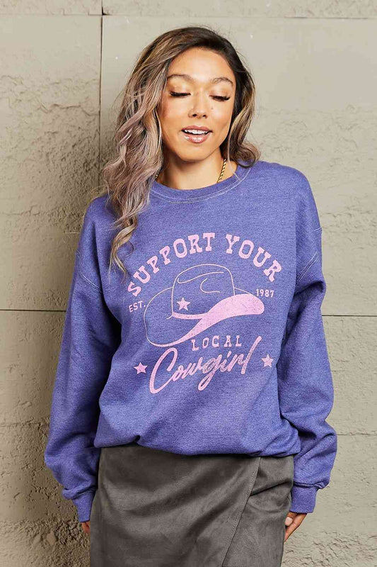 "Support Your Local Cowgirl" Oversized Crewneck Sweatshirt - Kawaii Stop - Casual Chic, Cowboy Boots, Cozy Comfort, Denim Fashion, Garment-Dyed, Graphic Print, Lived-in Color, Made in USA, Oversized Sweatshirt, Rodeo Style, Ship from USA, Support Local Cowgirls, Sweet Claire, Trendy Look, Unique Design, Western Fashion