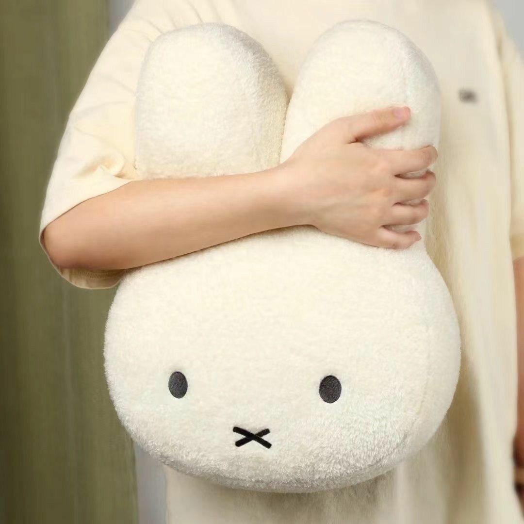 White Miffy rabbit plush pillow with long ears and simple black face