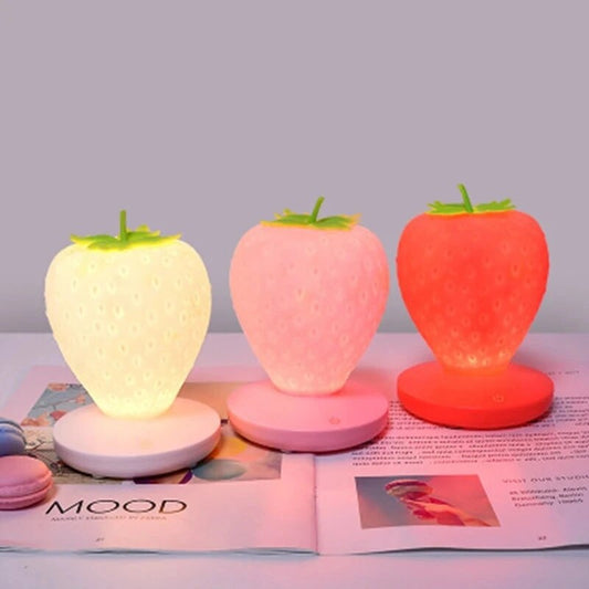 Strawberry Night Light - Kawaii Stop - ambient glow, ambient lighting, battery-powered, bedroom decor, bedside lamp, cozy atmosphere, easy installation, enchanting decor, home accessories, LED night light, low consumption, modern lighting, portable lighting, romantic lighting, soft glow, strawberry night light, touch switch, USB powered, versatile light, warm white light, whimsical light