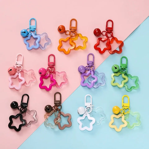 Colorful star charm keychains with bells, acrylic star pendants, and lobster clasps