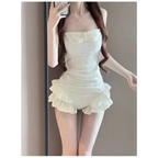 White strapless ruffled romper.